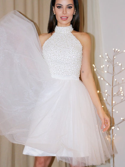 A-Line/Princess Sleeveless Halter Beading Tulle Short/Mini Homecoming Dresses